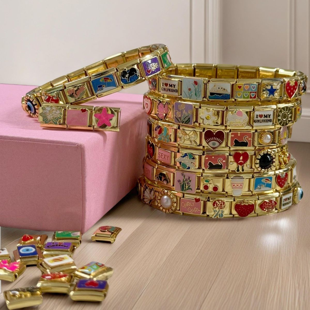 Close up of Italian charm bracelets with stainless steel modular links and colorful charms