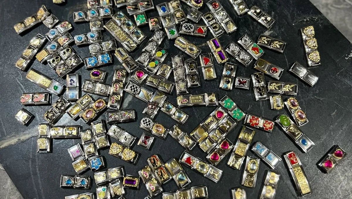 Custom Italian charm bracelet featuring mixed-style charms including sea, letters, hearts, food, and stone designs