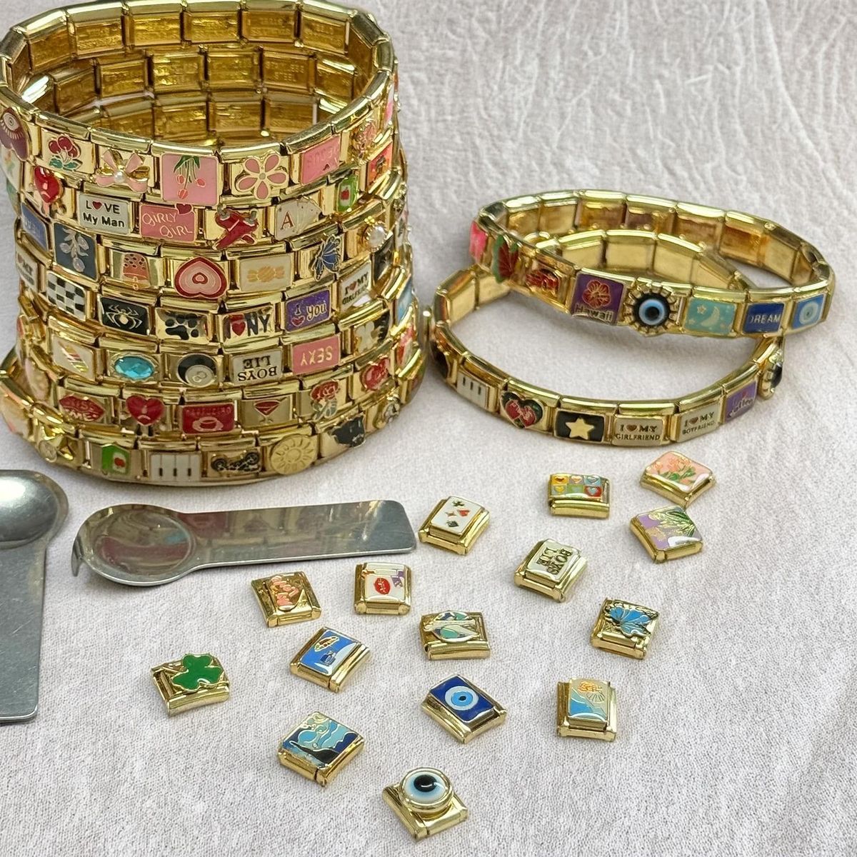 Gold Italian charm bracelet shining under soft light