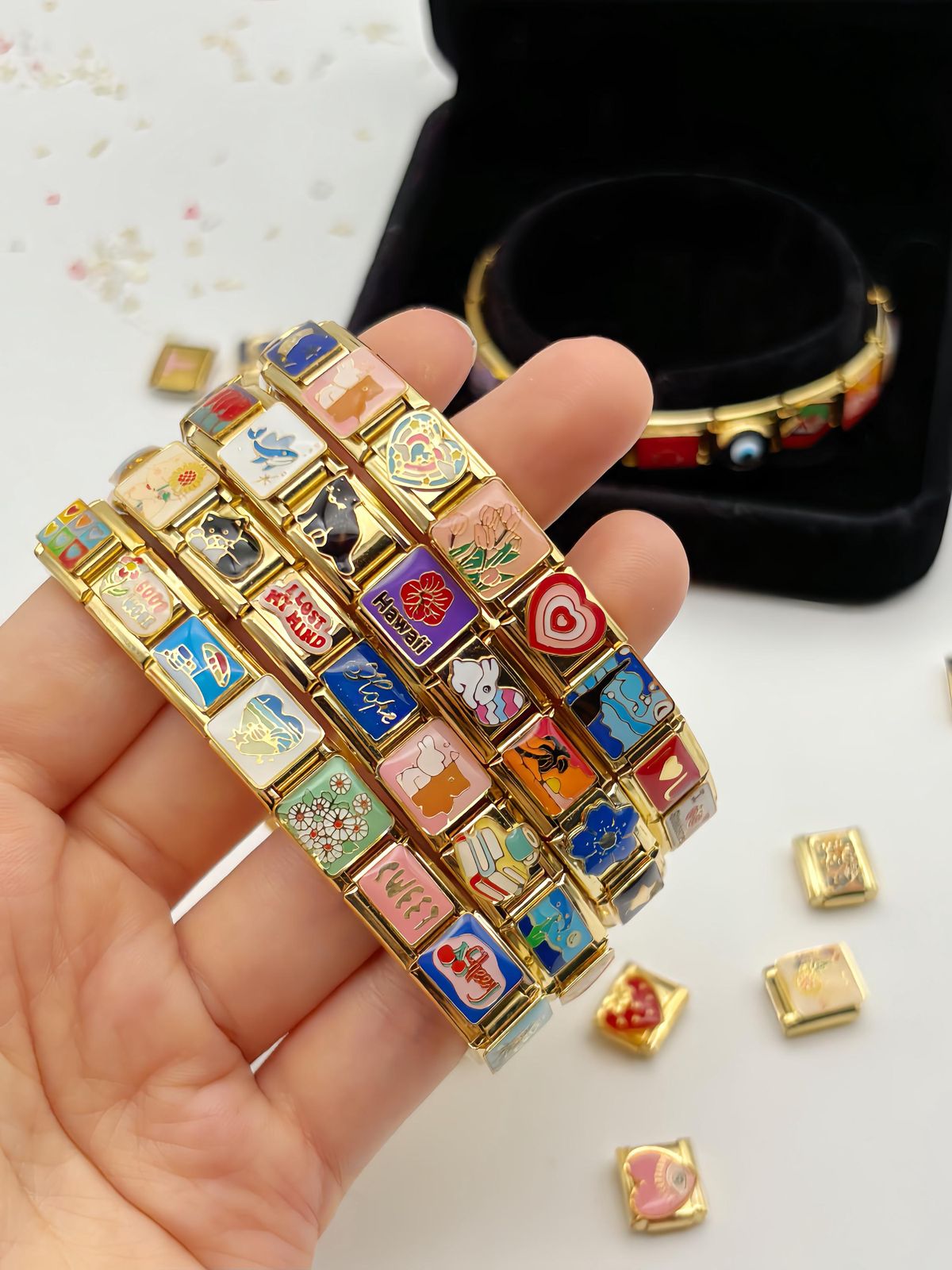 Vintage Italian charm bracelet held in hand representing memories and timeless beauty