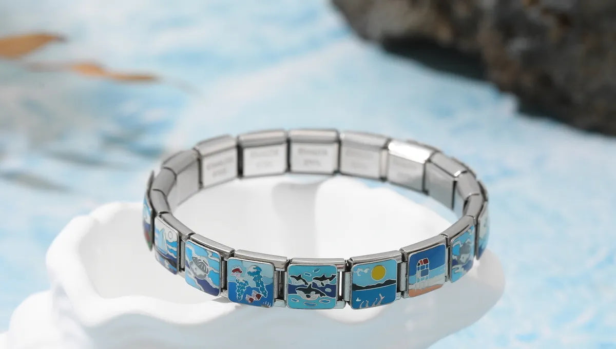 Finished custom Italian charm bracelet displayed with stainless steel links and personalized charms – CHARMSDIY