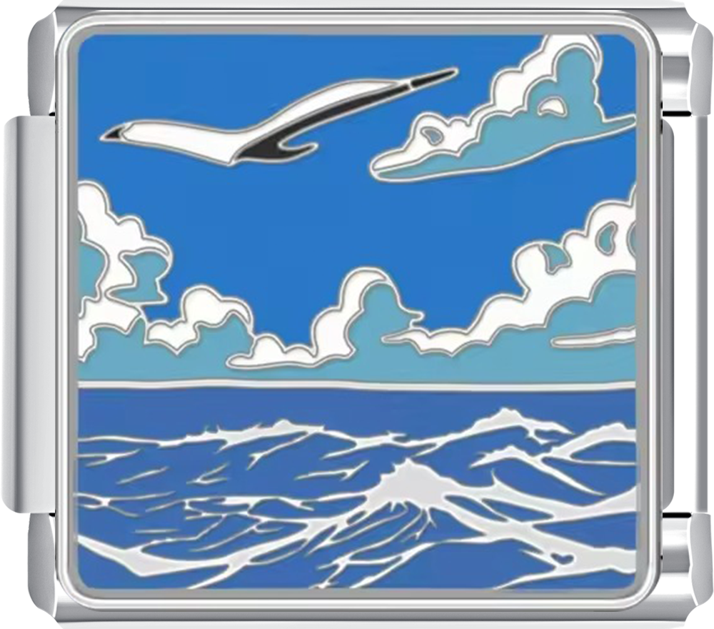 Metallic charm with an airplane and ocean design on a blue background