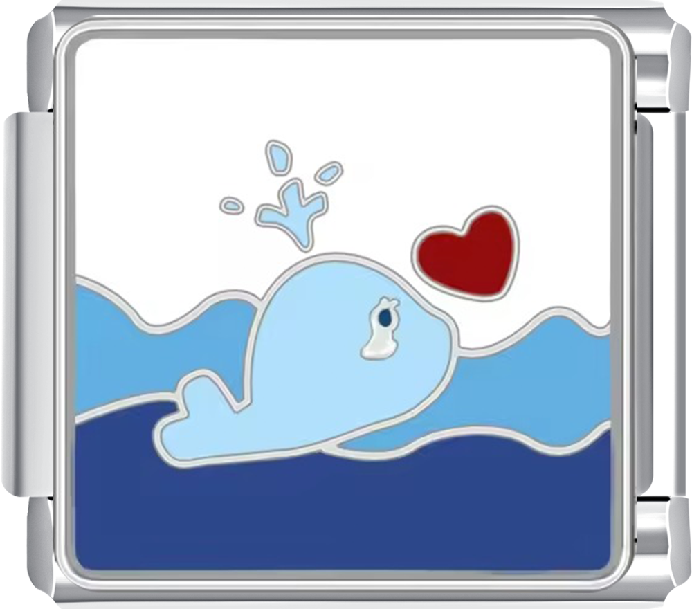 Decorative charm with a whale and heart design on a white background