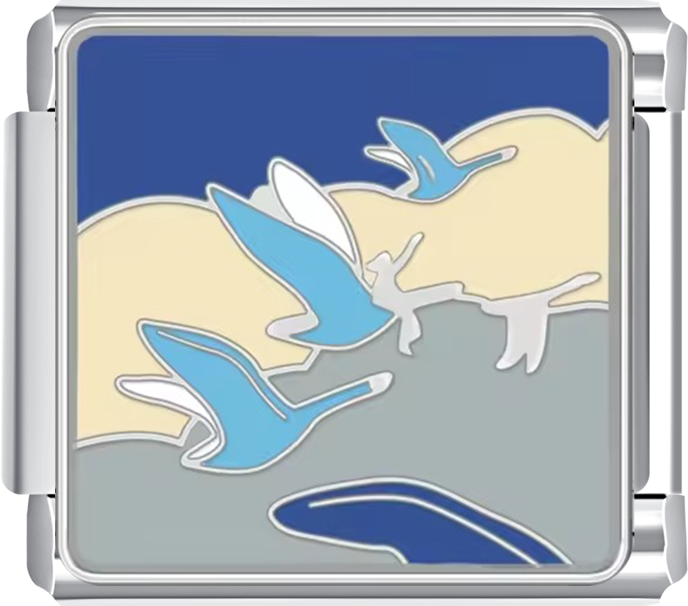 Metallic charm with blue and silver bird design on a blue background