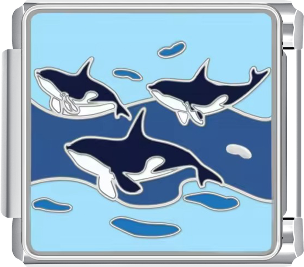 Metallic charm with sharks design on a blue background