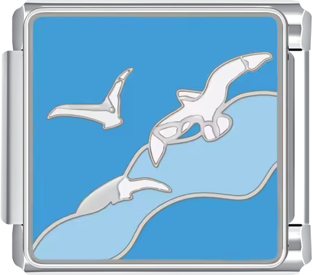 Silver charm with a design of three birds flying against a blue background
