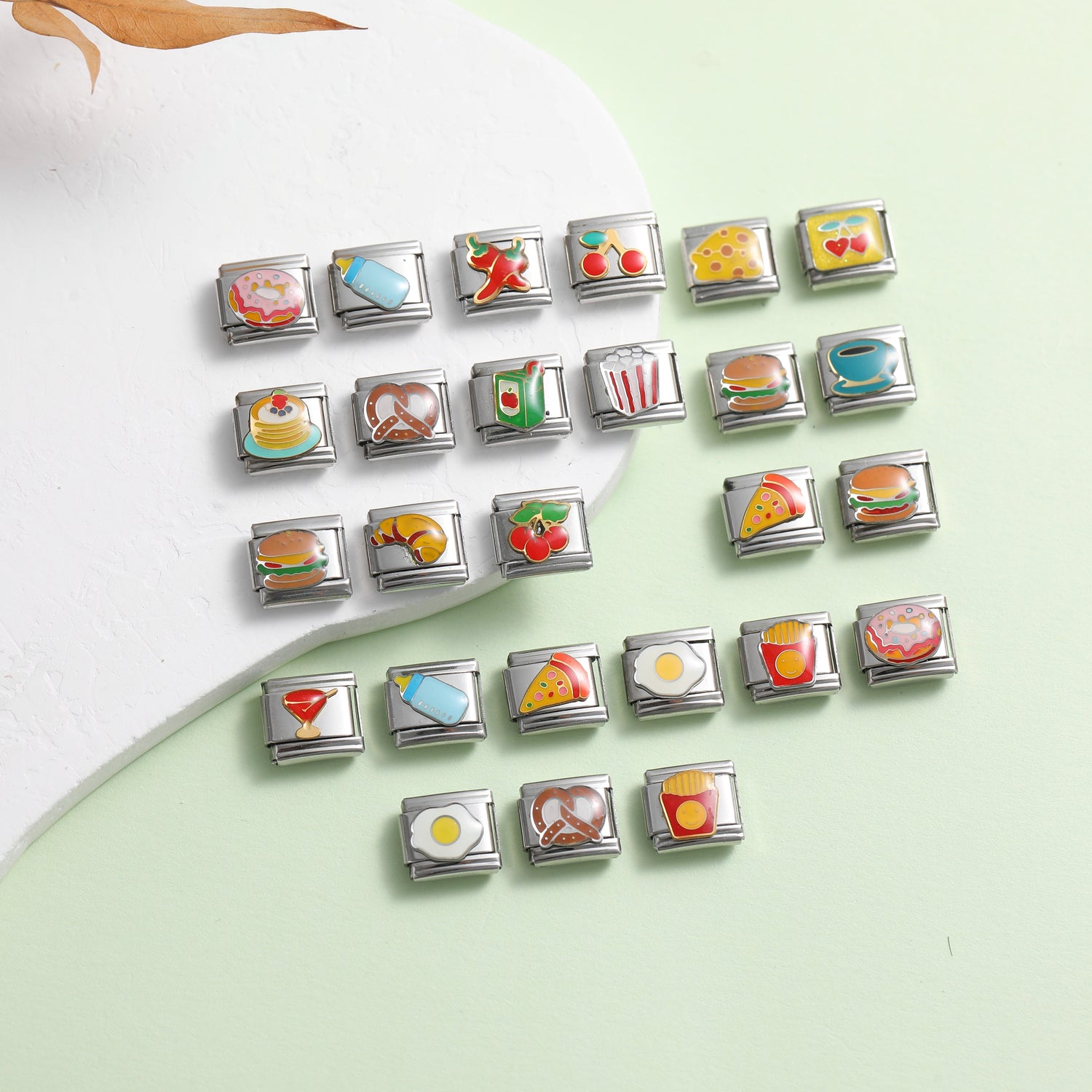 Italian charm bracelet food theme charms with pizza, burger, fries, coffee and dessert designs on green background