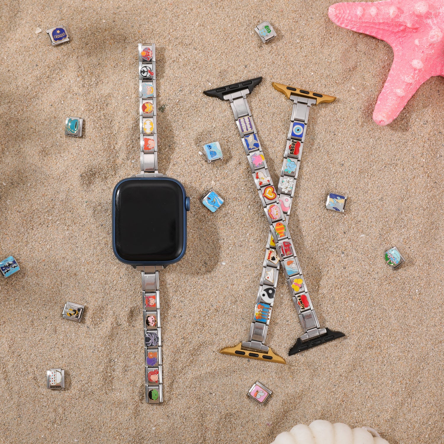Italian charm watch band on beach sand with colorful charm links