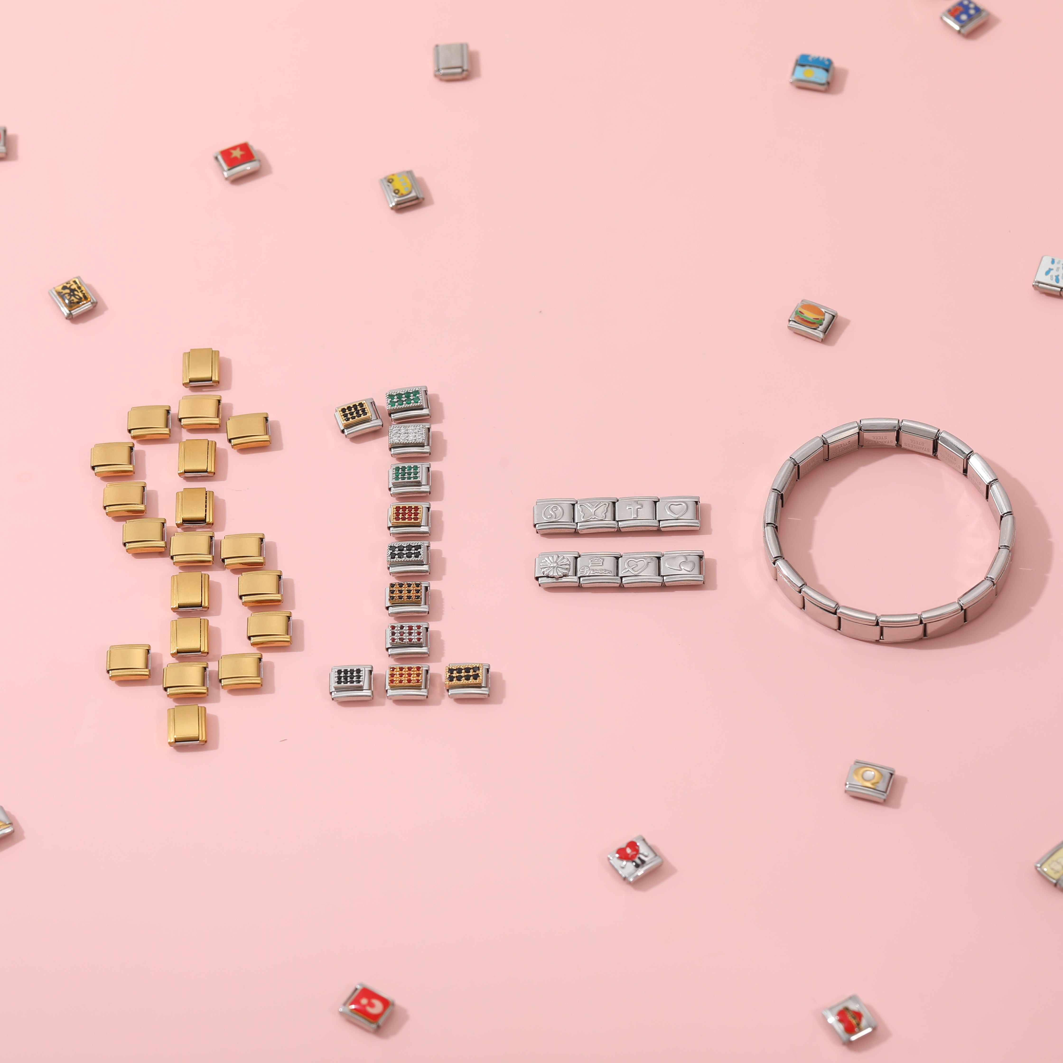 Italian charm bracelet base with interchangeable charm links arranged on a pink background for DIY customization