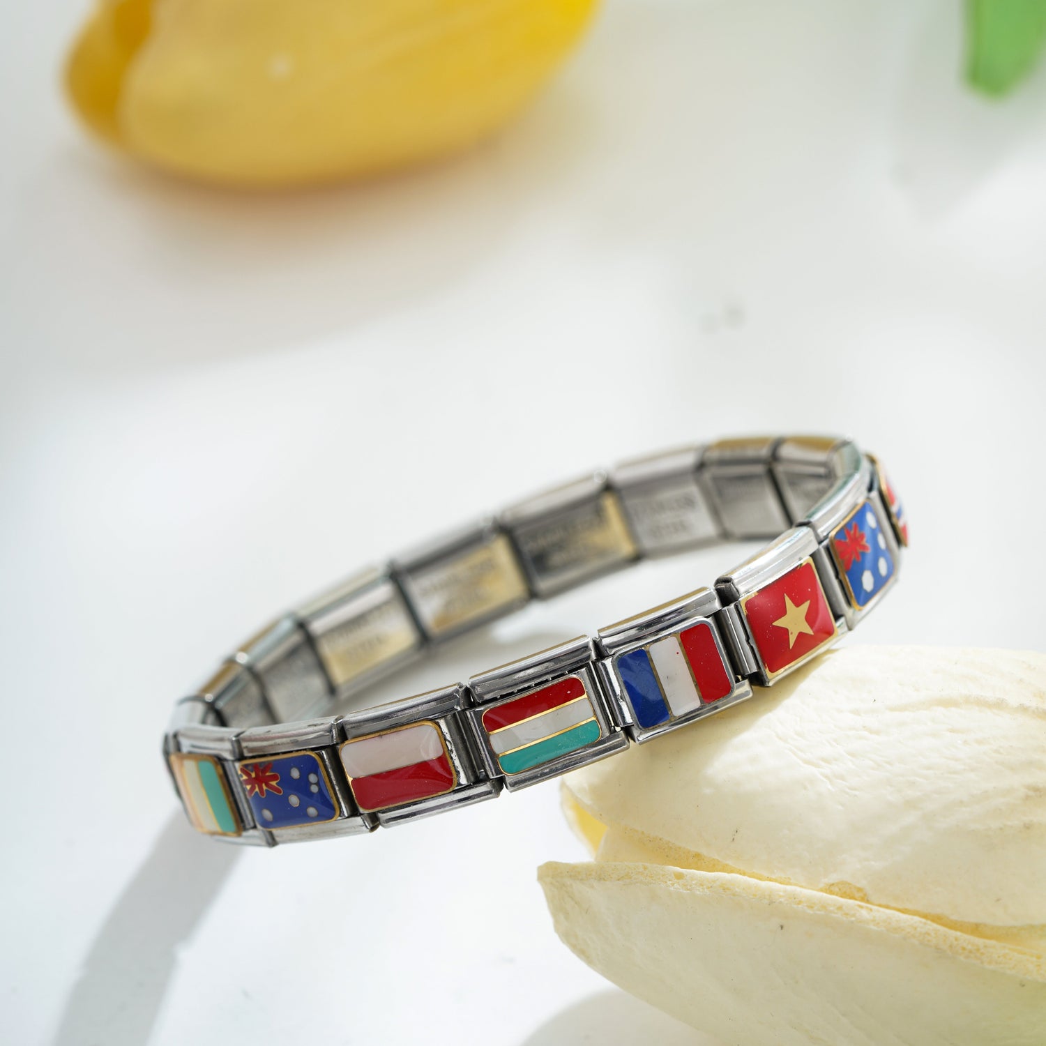 italian charm bracelet with country flag charms on wrist travel themed jewelry