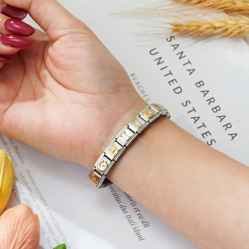 woman wear a letters charm bracelet which is exquisite.