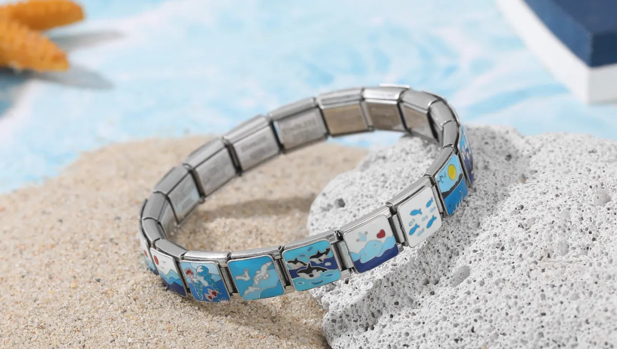 Assembled Italian charm bracelet with sea-themed stainless steel charms, including starfish, shells, and waves – CHARMSDIY