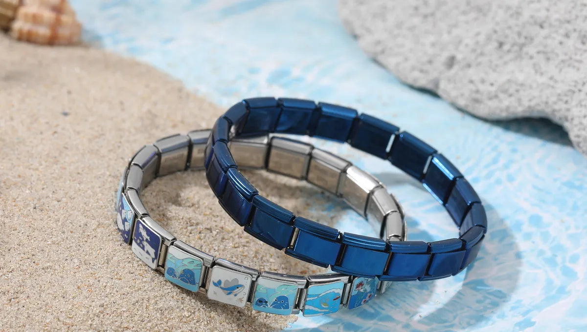 Two stacked custom Italian charm bracelets showcasing modular stainless steel links and personalized charm combinations – CHARMSDIY